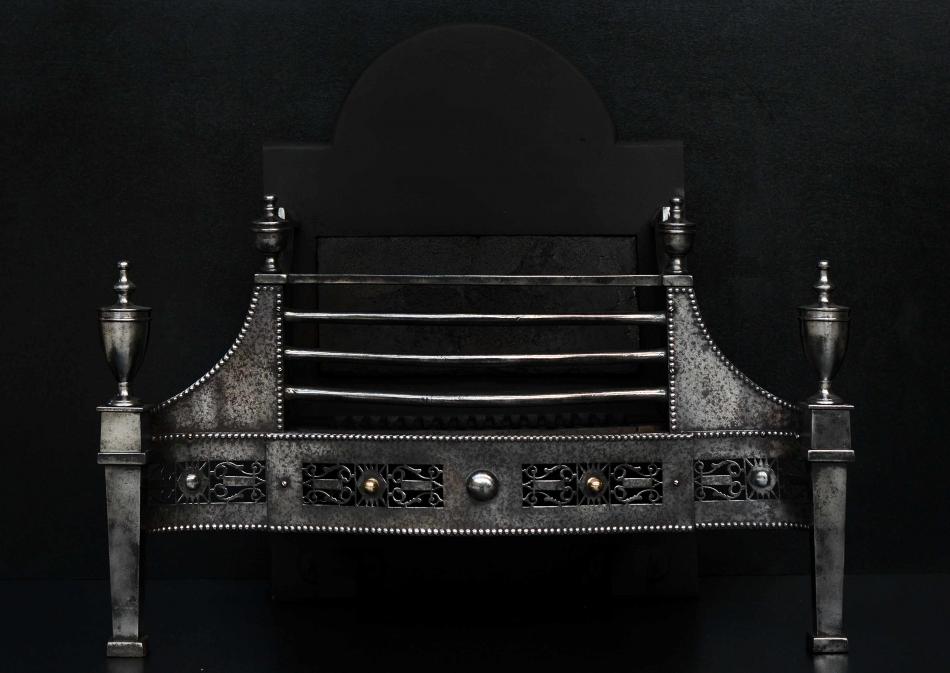A George III style steel firegrate with pierced fret