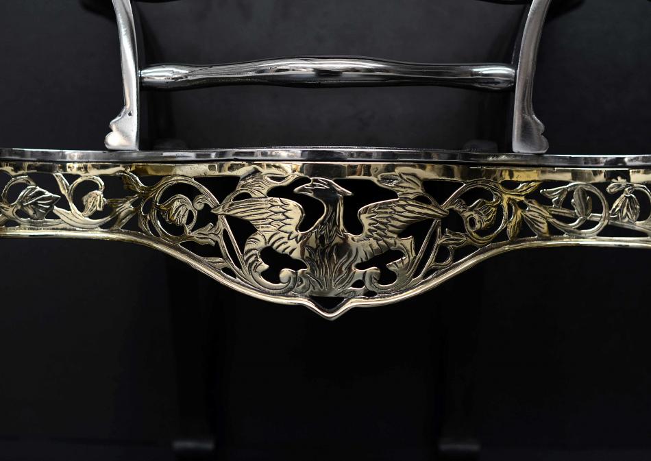 An engraved brass and steel firegrate