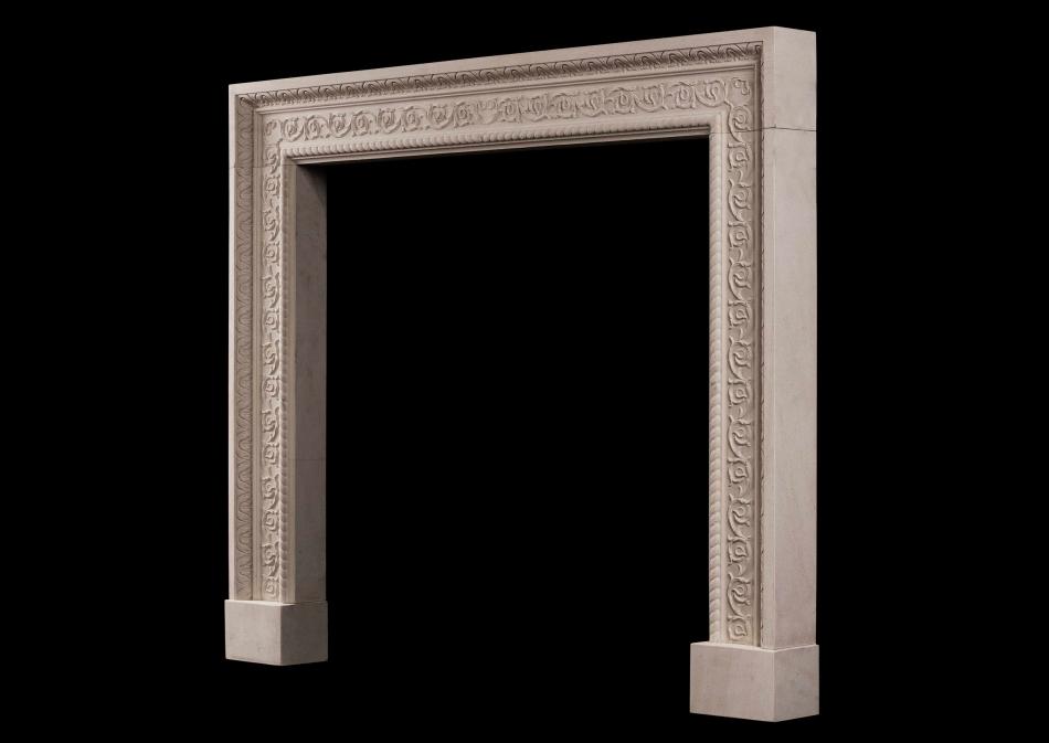 A carved English stone Fireplace with scrolled detailing