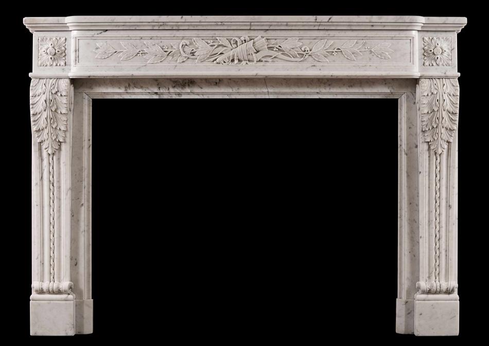 A Louis XVI style French antique fireplace in Carrara marble