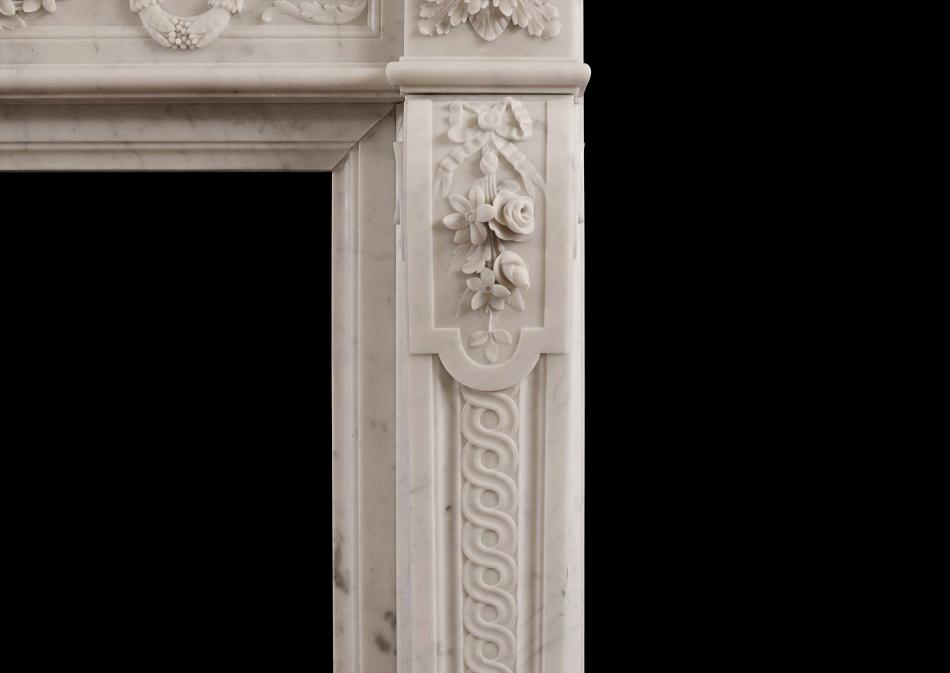 A well carved Louis XVI style French antique fireplace