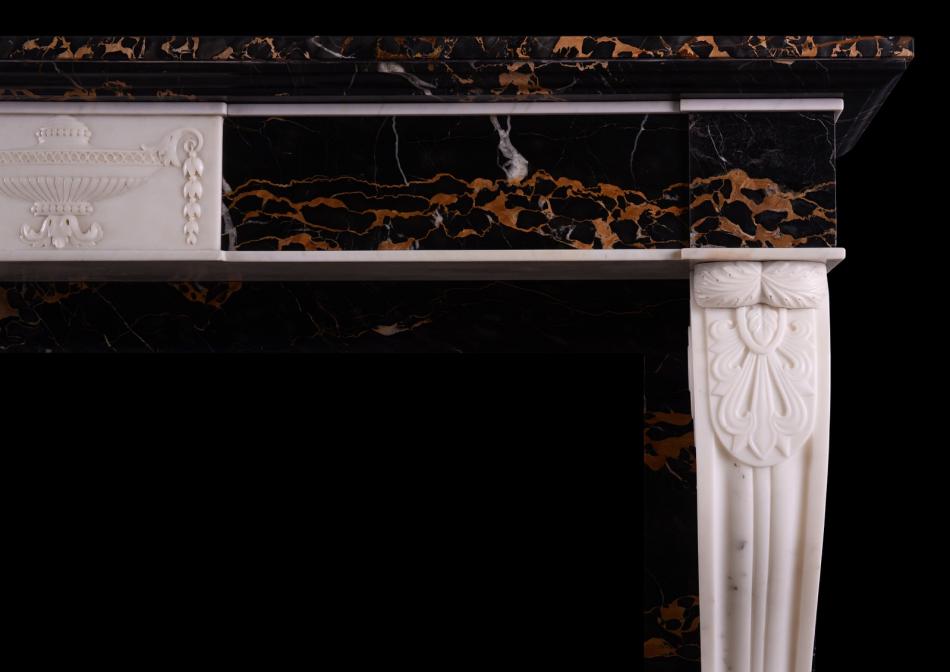An Italian Portoro and Statuary marble fireplace