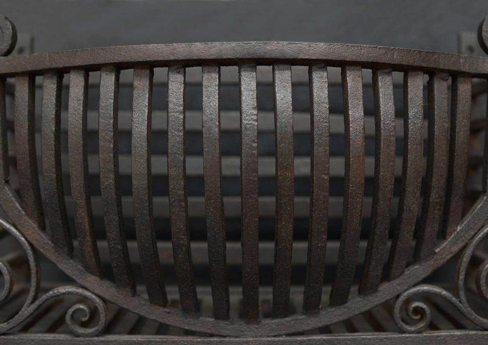 A late 19th century wrought iron firebasket
