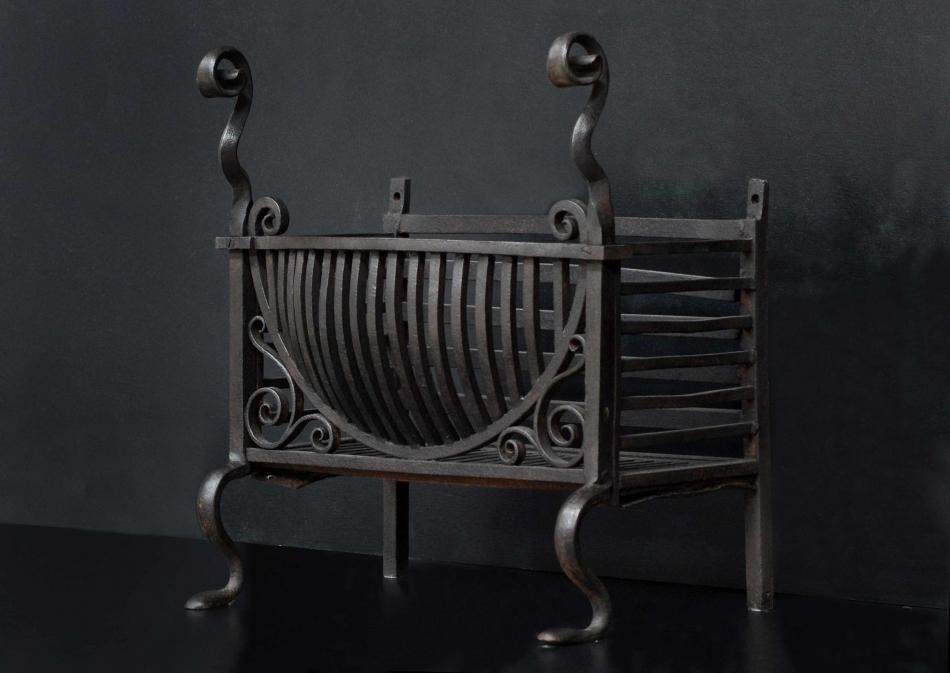 A late 19th century wrought iron firebasket