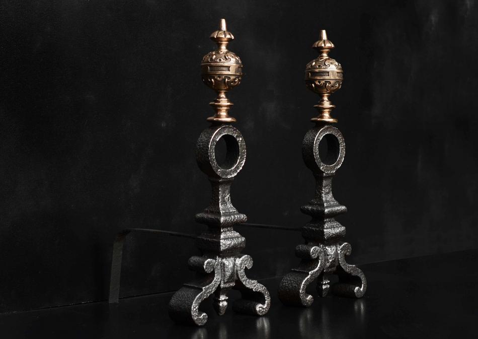 A pair of bronze and cast iron firedogs in the Baroque style