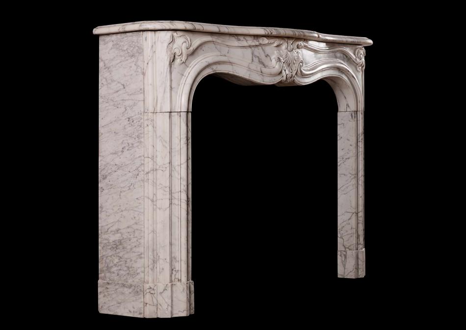 A French marble fireplace in the Rococo manner