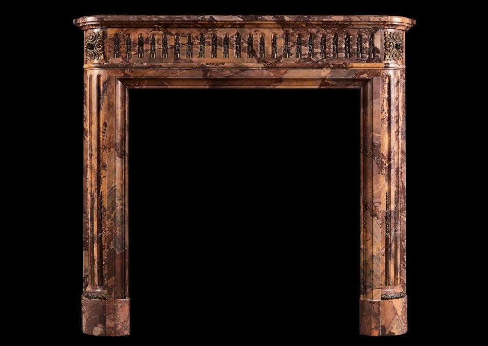 A petite Louis XVI style marble fireplace