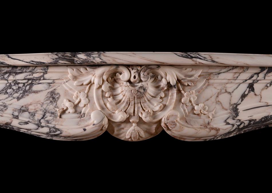 A beautiful Louis XV Breche Violette antique marble fireplace