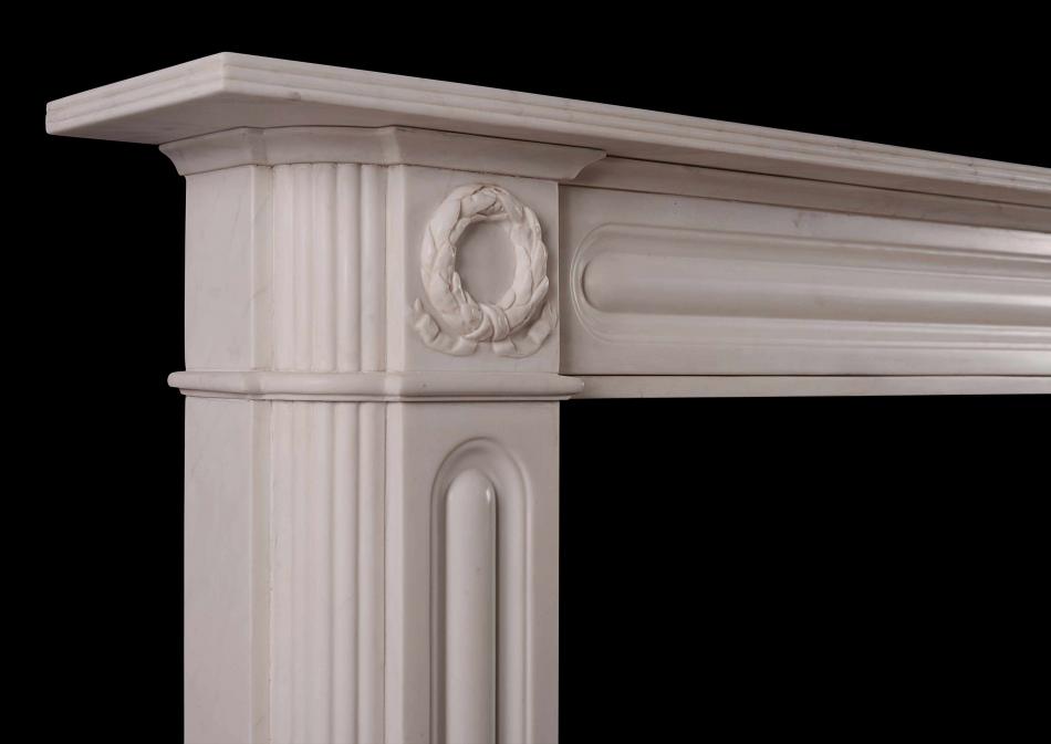 An English Regency marble fireplace in white marble