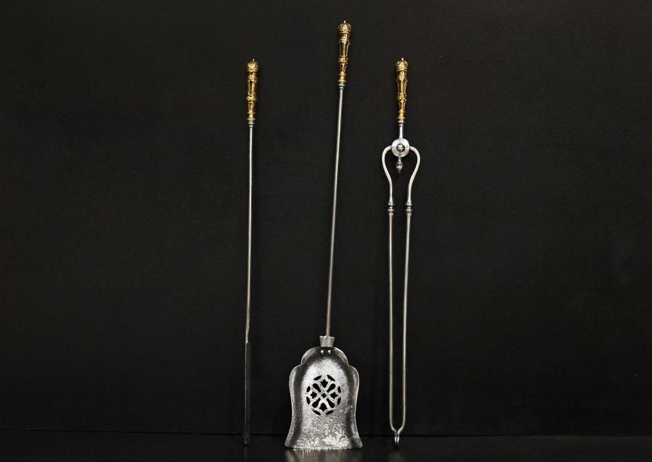 A set of 19th century steel and brass firetools