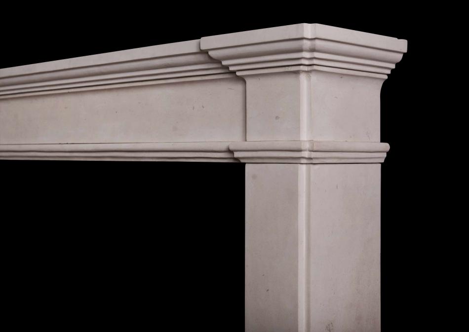 An architectural French limestone fireplace