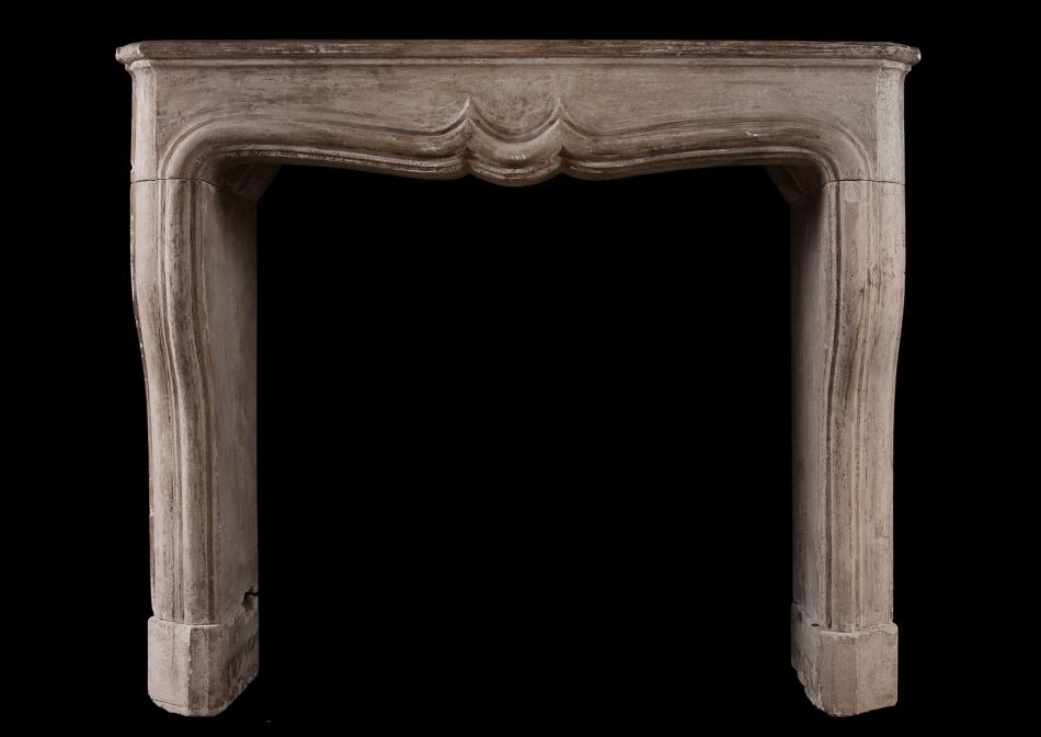 A rustic Louis XIV French fireplace