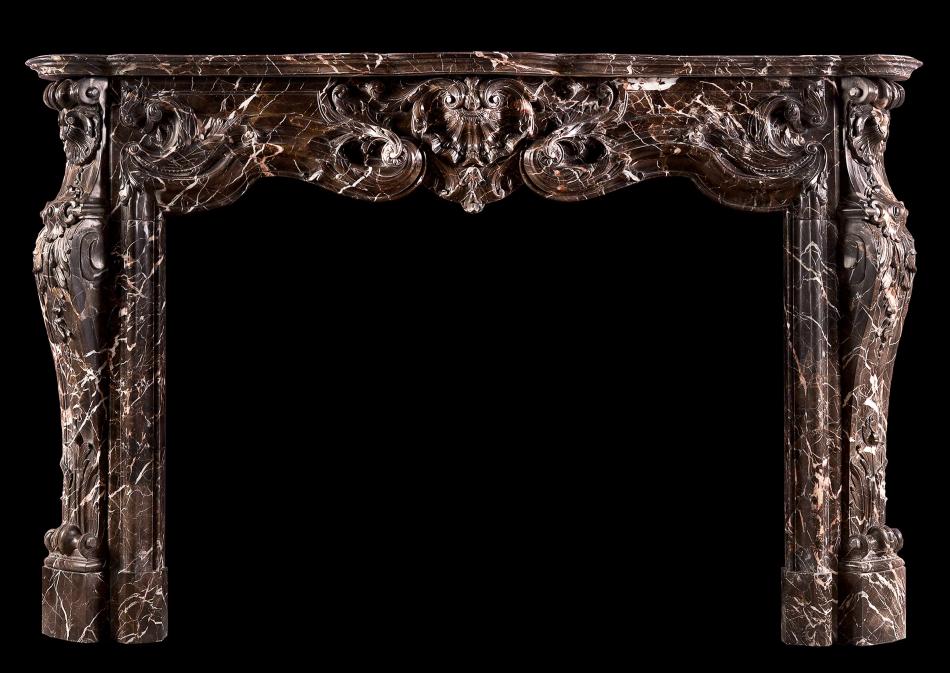 A sumptuous Emperador marble Louis XV style marble fireplace