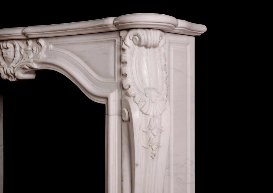 A French transitional Louis XIV/XV marble fireplace