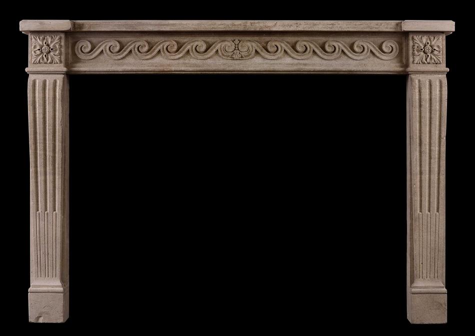 A French stone fireplace in the Louis XVI style