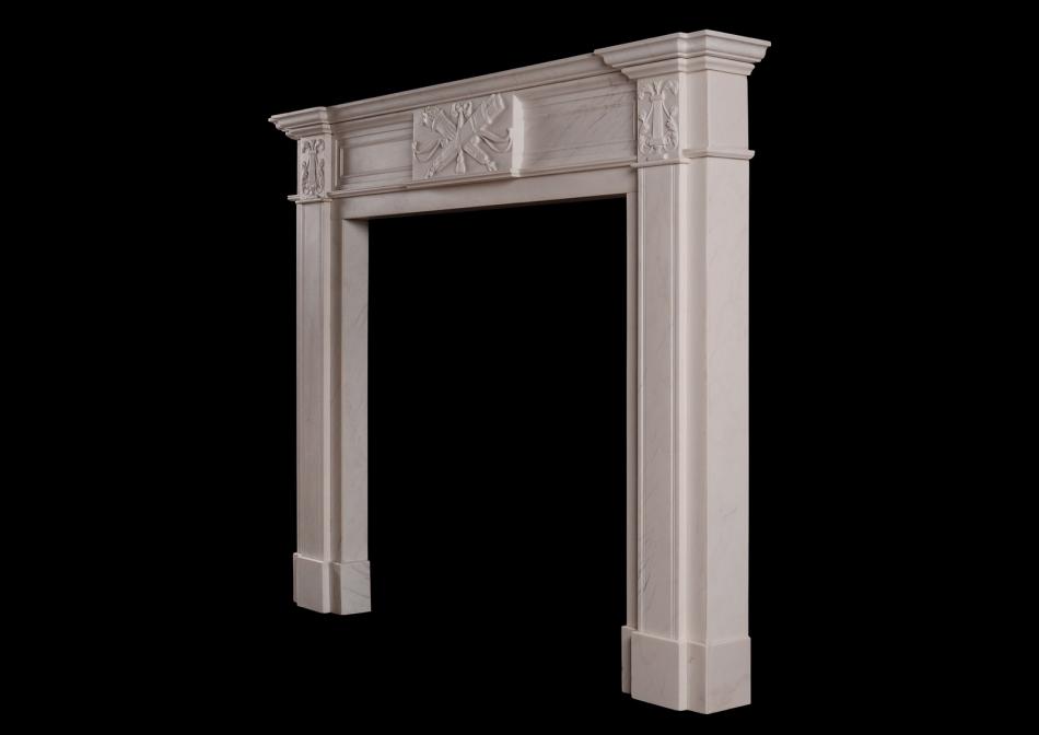 A white marble fireplace in the late Georgian manner