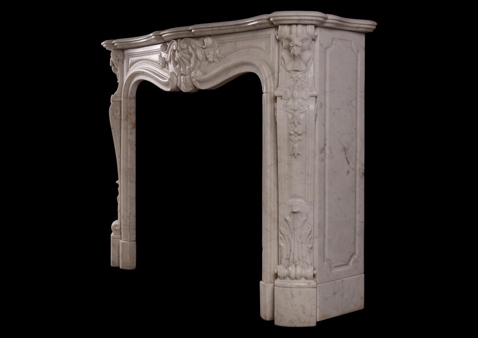 A French Louis XV style Carrara marble fireplace