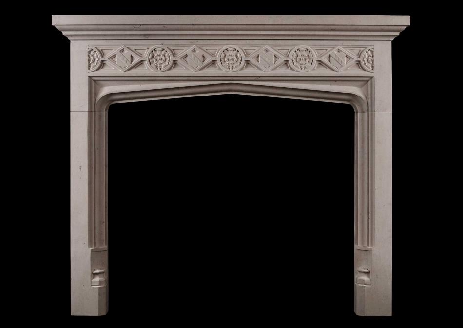 A Gothic style limestone fireplace