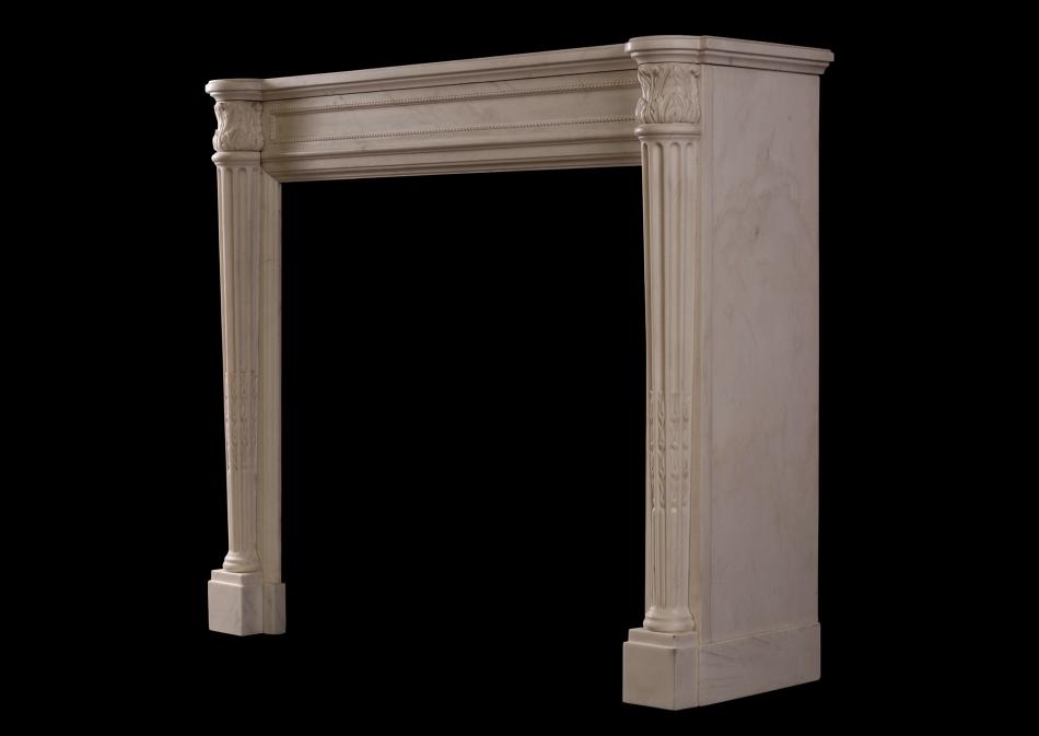 A white marble fireplace in the Louis XVI manner