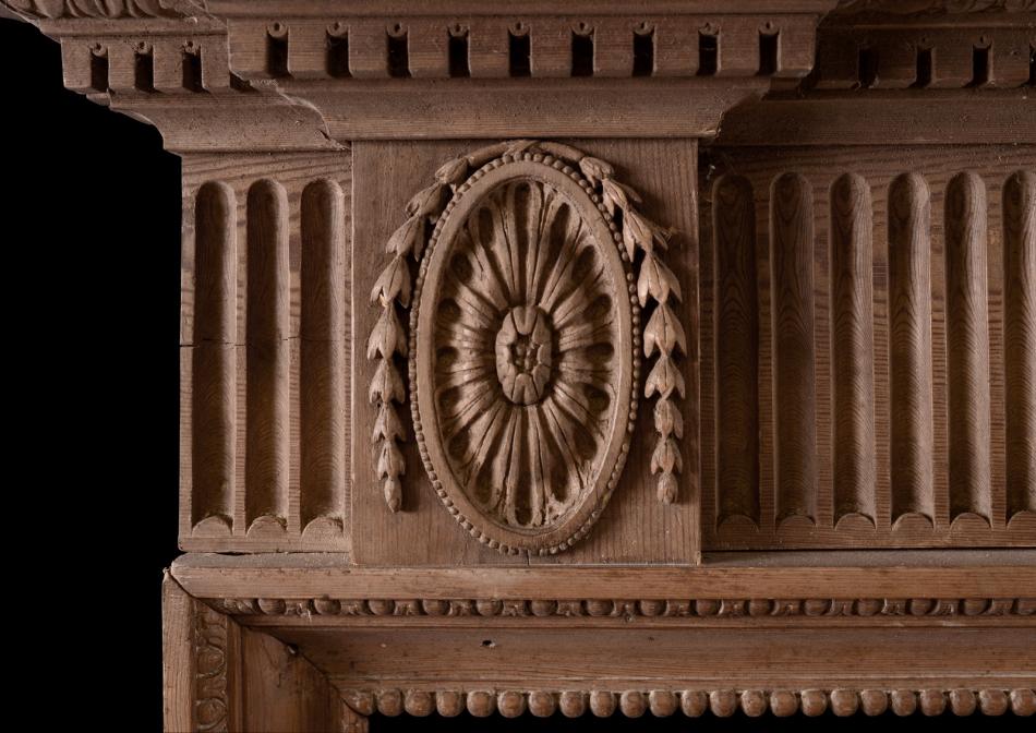 A finely carved English wood fireplace