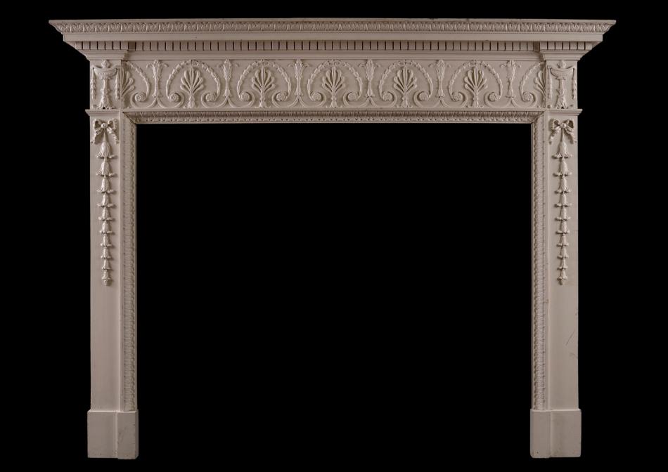 An English wood fireplace in the George III style