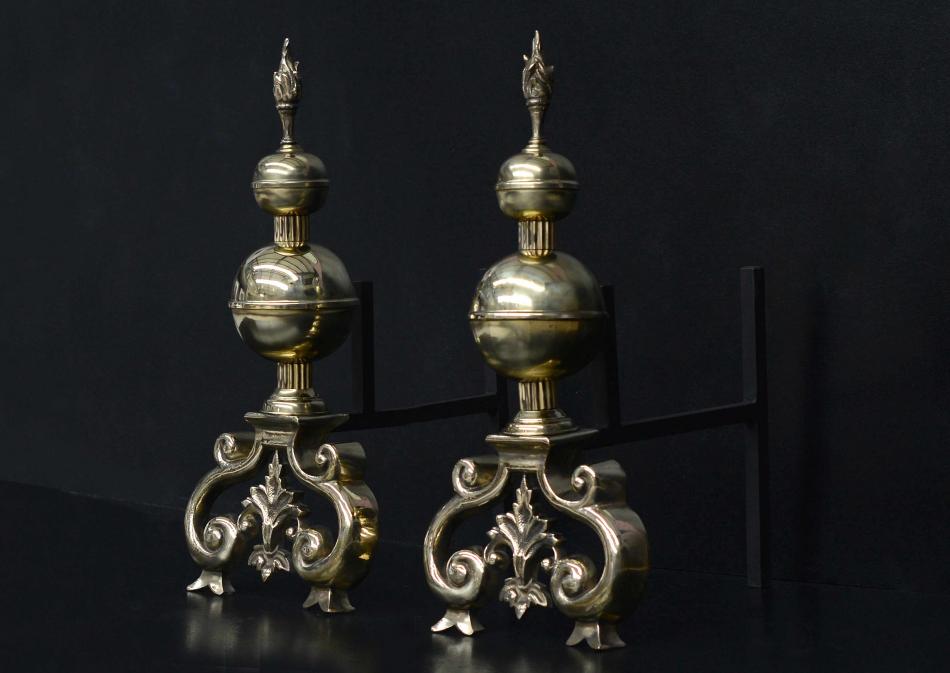 A substantial pair of English brass firedogs