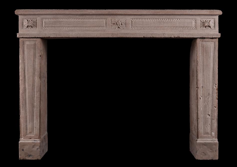 A carved French Louis XVI fireplace