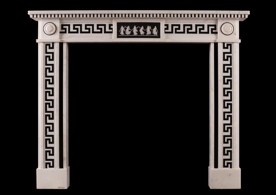 A Regency style white marble fireplace with black inlay