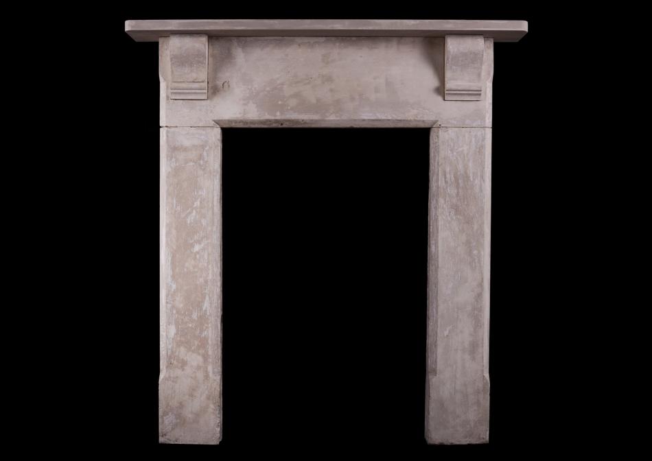 A shabby chic English stone fireplace