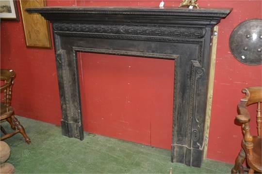 A polished cast iron fireplace in the mid Georgian style