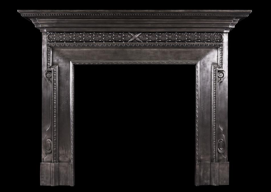 A polished cast iron fireplace in the mid Georgian style