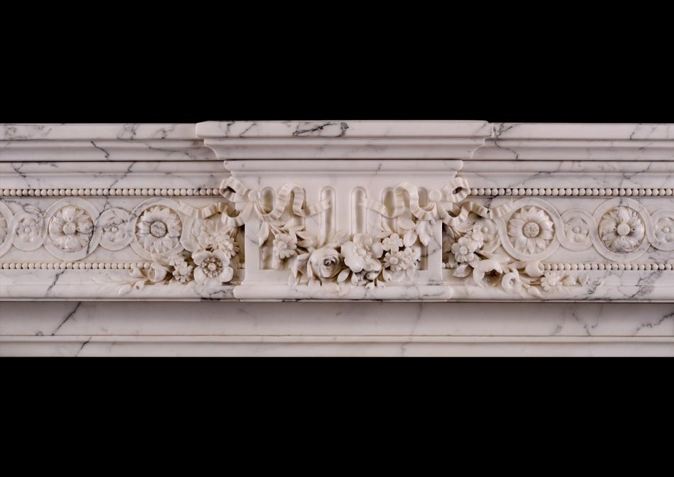 A veined Statuario French marble chimneypiece