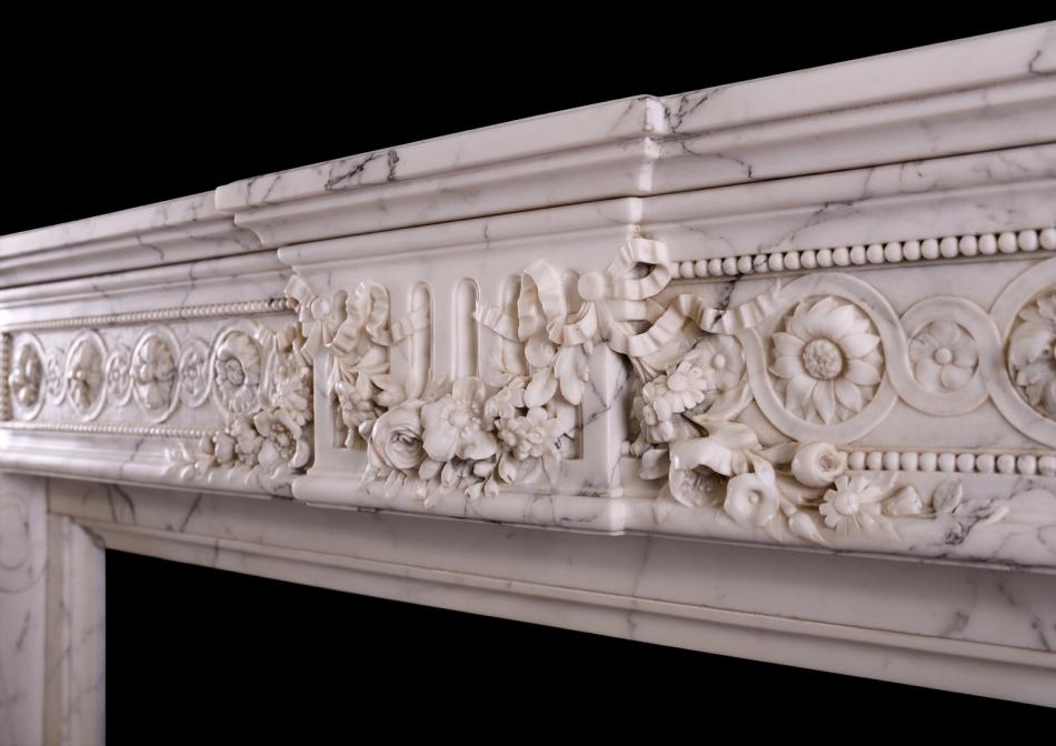 A veined Statuario French marble chimneypiece