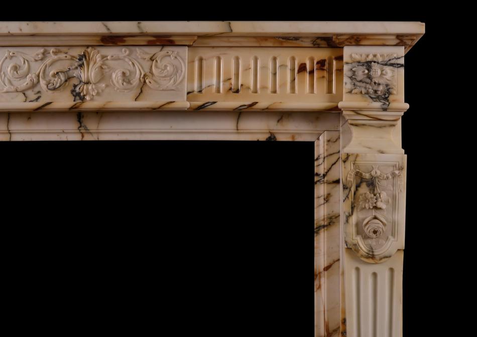 A French Louis XVI style Pavonazzo marble antique fireplace
