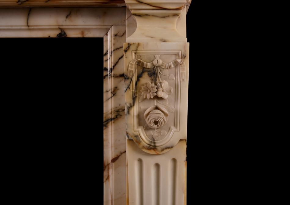 A French Louis XVI style Pavonazzo marble antique fireplace
