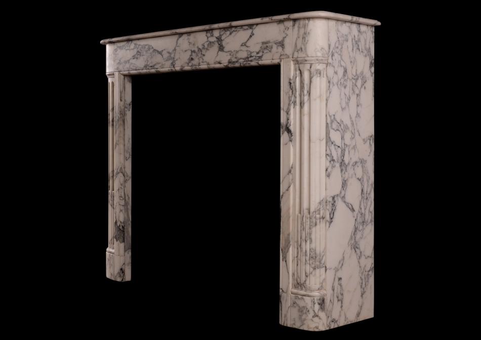 An architectural French Louis XVI style marble fireplace