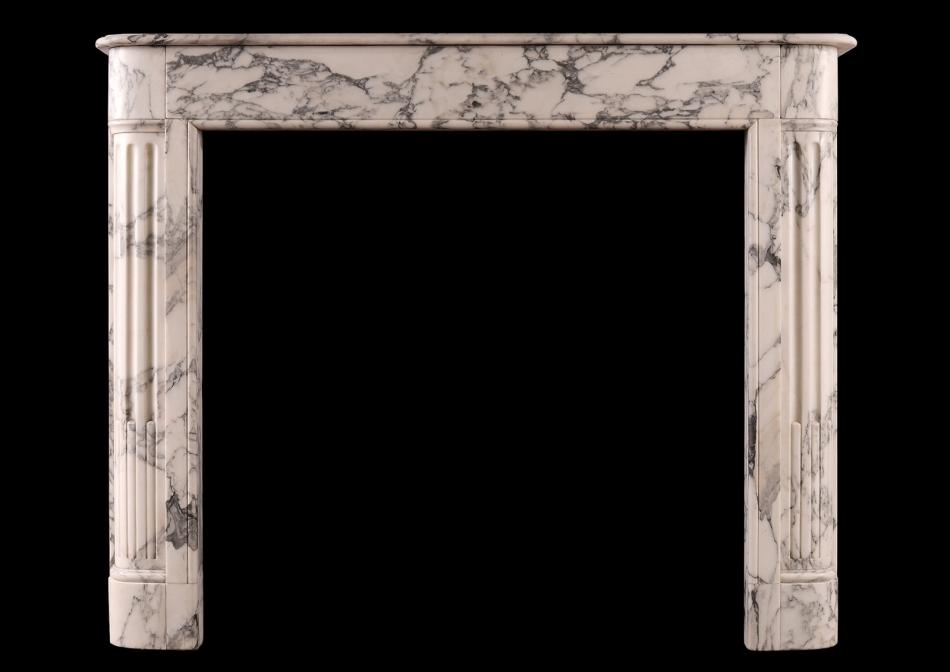An architectural French Louis XVI style marble fireplace