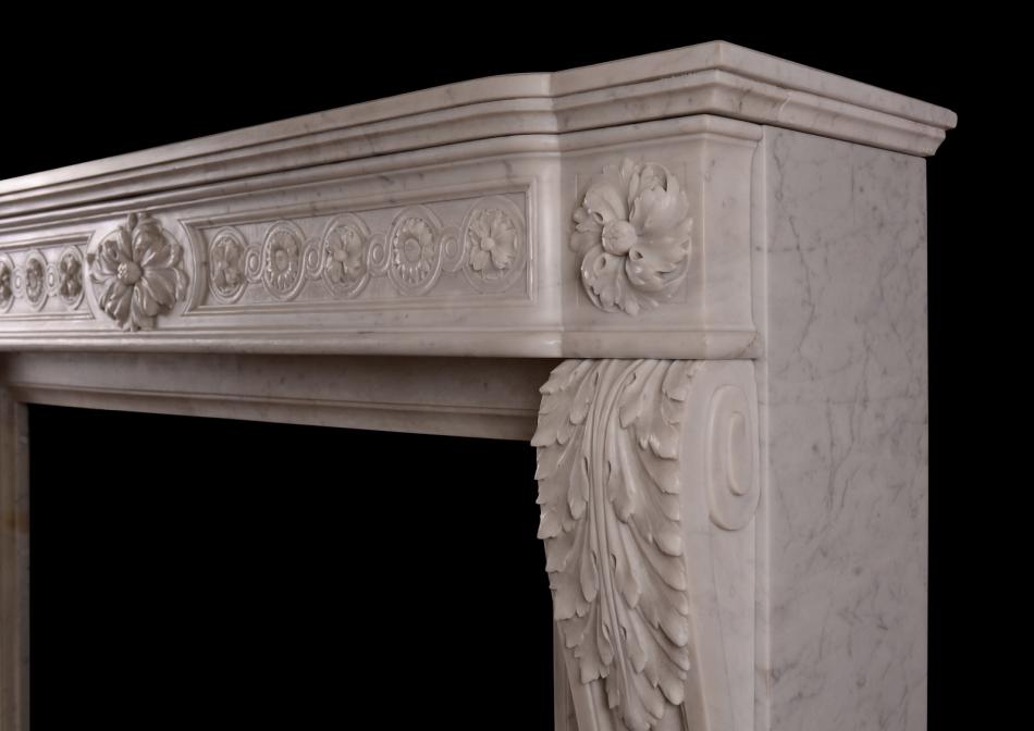 A French Louis XVI style marble fireplace in Carrara marble