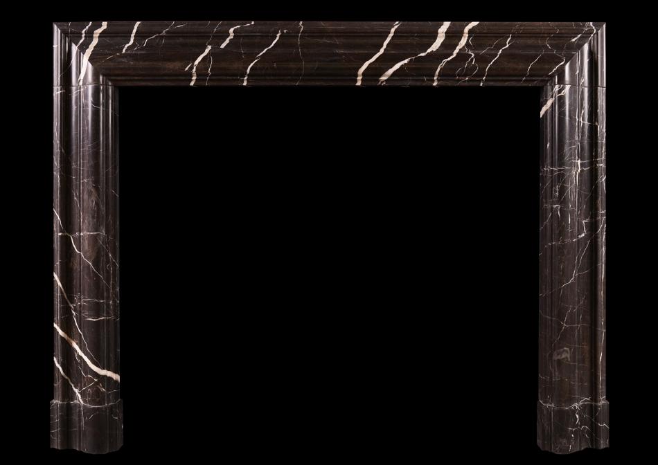 A bolection fireplace in Bruno Marquina marble