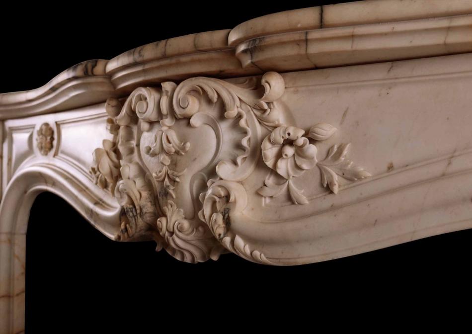 A fine quality French Louis XV style fireplace in Pavonazzo marble