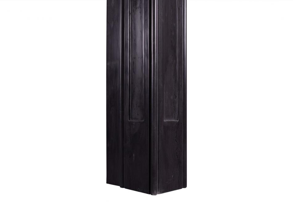 A black marble Art Deco style fireplace