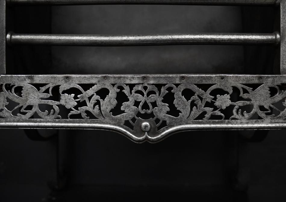 A Georgian polished cast iron firegrate