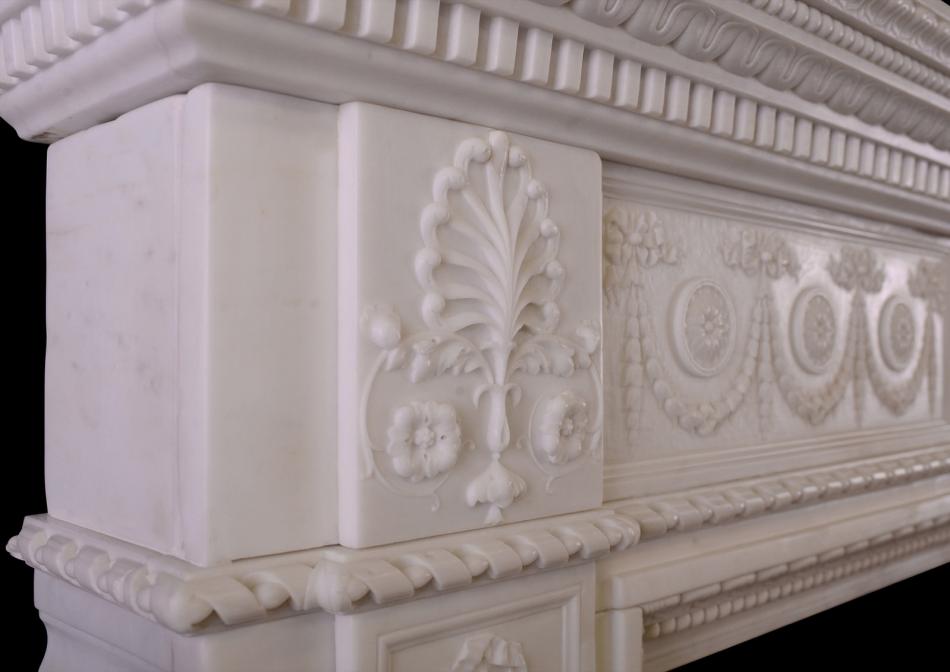 A finely carved Statuary marble fireplace with birds to centre block