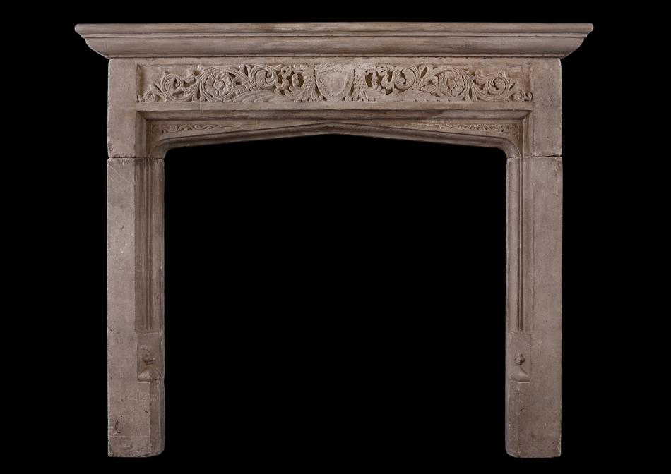 An English 19th century Bath stone fireplace in the Gothic style