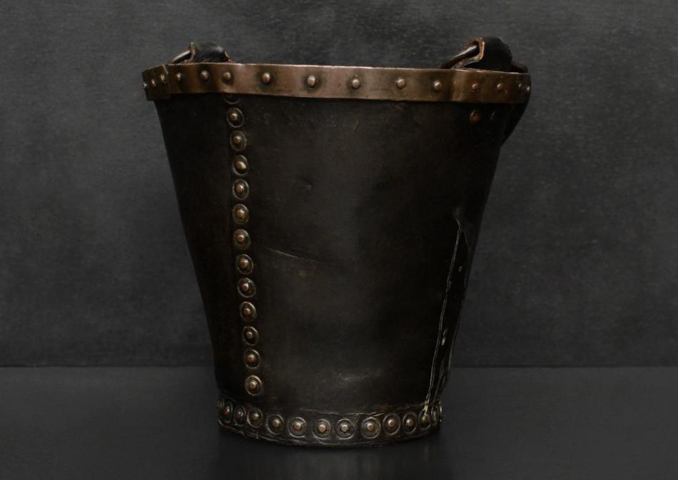 A small leather coal bucket