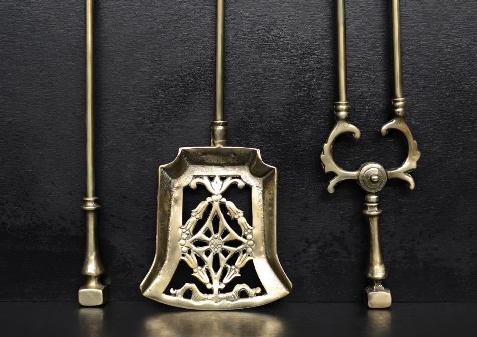 A set of brass Victorian fire tools