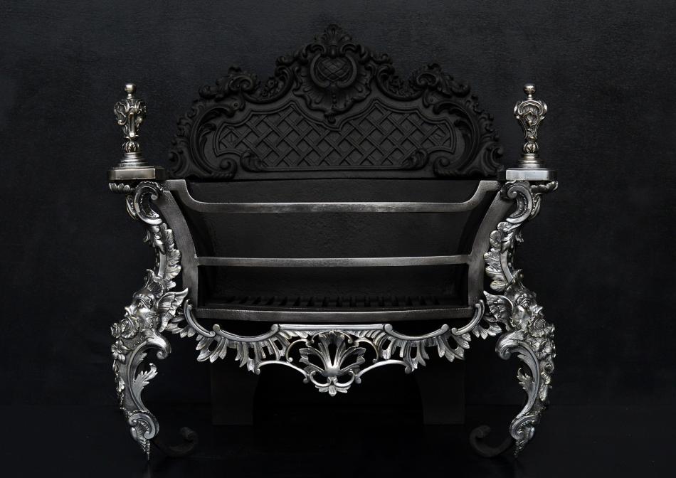 A decorative Rococo firegrate in German silver