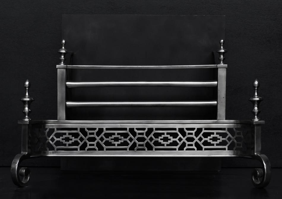 A polished steel firegrate in the Georgian style