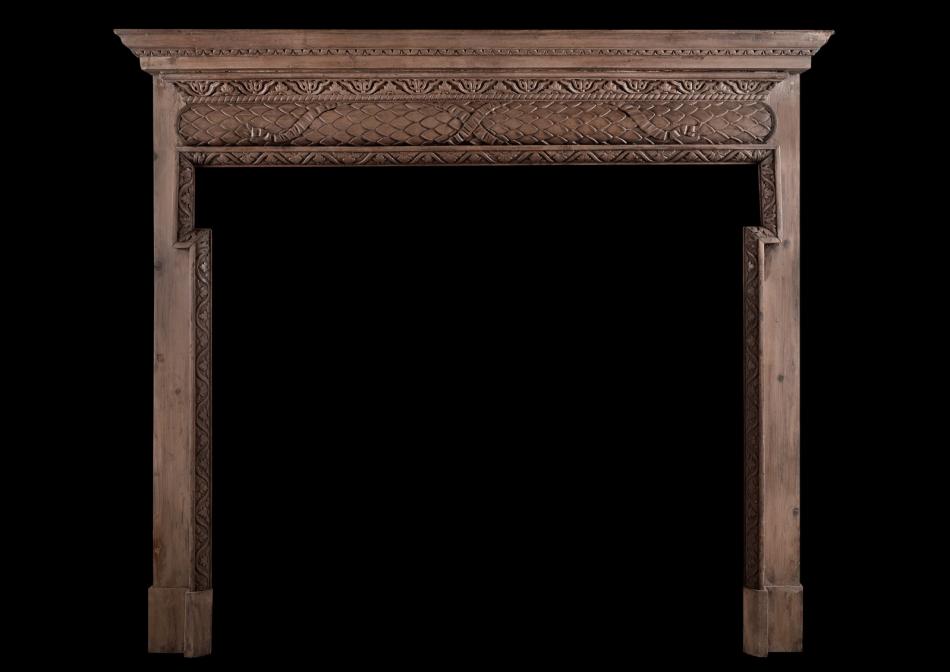 An English carved pine fireplace