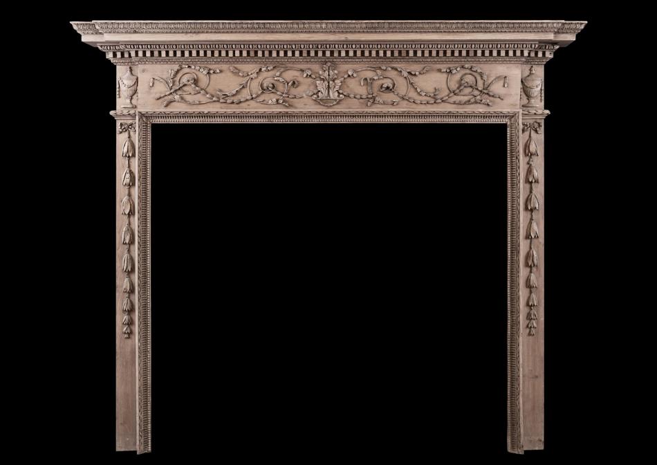 A fine quality Georgian carved pine fireplace